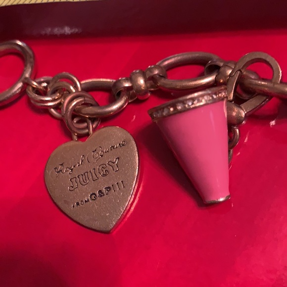 JUICY COUTURE 3 CHARM BRACELET. ONE NOT REMOVABLE